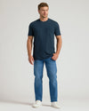 Model in Classic Pocket Crew 3-Pack outfit: dark teal/navy tee, mid-blue jeans.