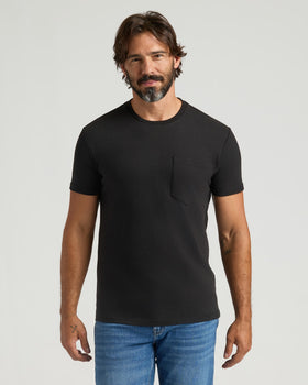 Man wearing Black Heavyweight Pocket Crew, showcasing its durable design.