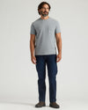 Man wearing Timeless Heavyweight Pocket Crew in heather gray with jeans.
