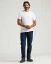 Man in All White Heavyweight Pocket Crew Neck, jeans, boots.