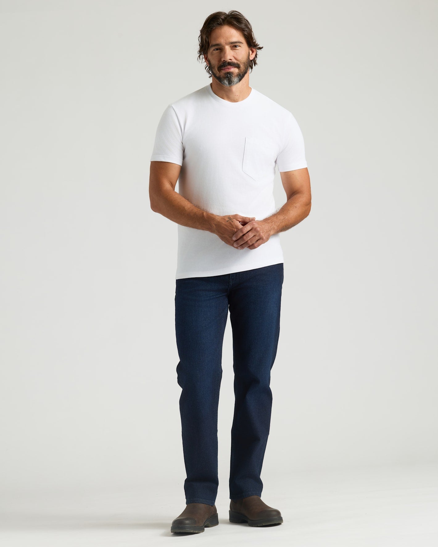 Man in All White Heavyweight Pocket Crew Neck, jeans, boots.