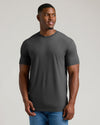Man in Charcoal Heather Gray Tall Crew Neck T-Shirt and blue jeans.
