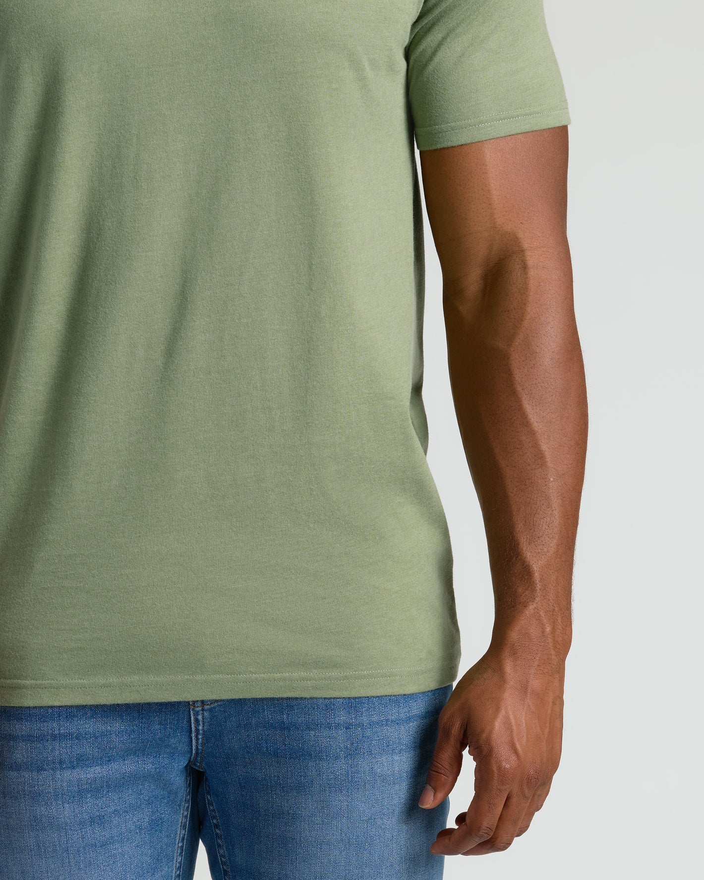 Dark Heather Bay Green Tall Straight Hem Crew Neck T-Shirt with blue jeans.