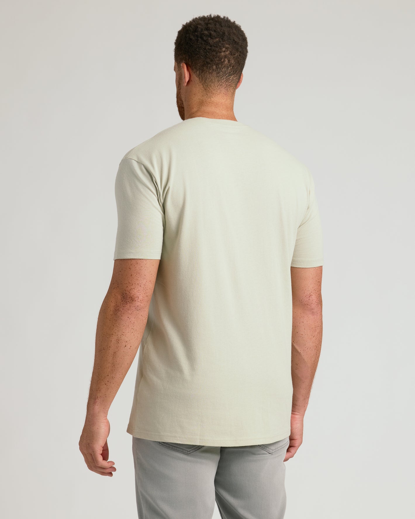 Back view of a man wearing a Dark Heather Graystone Tall Straight Hem Crew Neck T-Shirt.