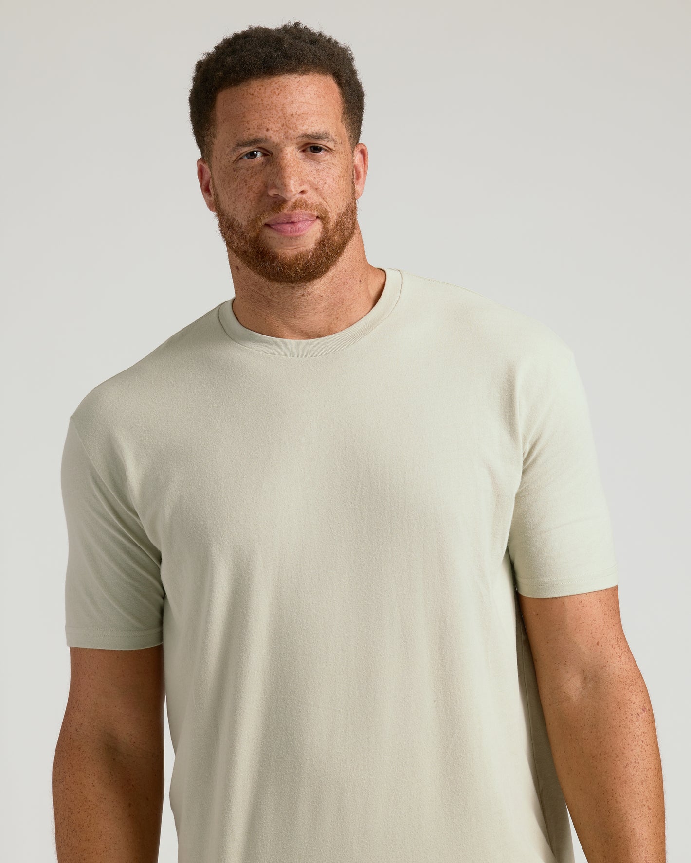 Man wearing Dark Heather Graystone Tall Straight Hem Crew Neck T-Shirt.