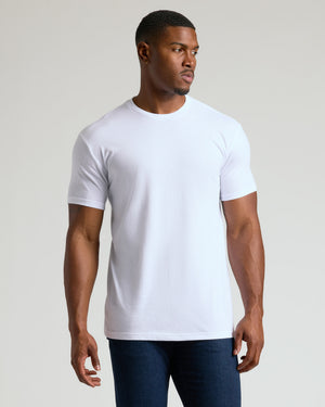 Man wearing White Tall Straight Hem Crew Neck T-Shirt with dark jeans.