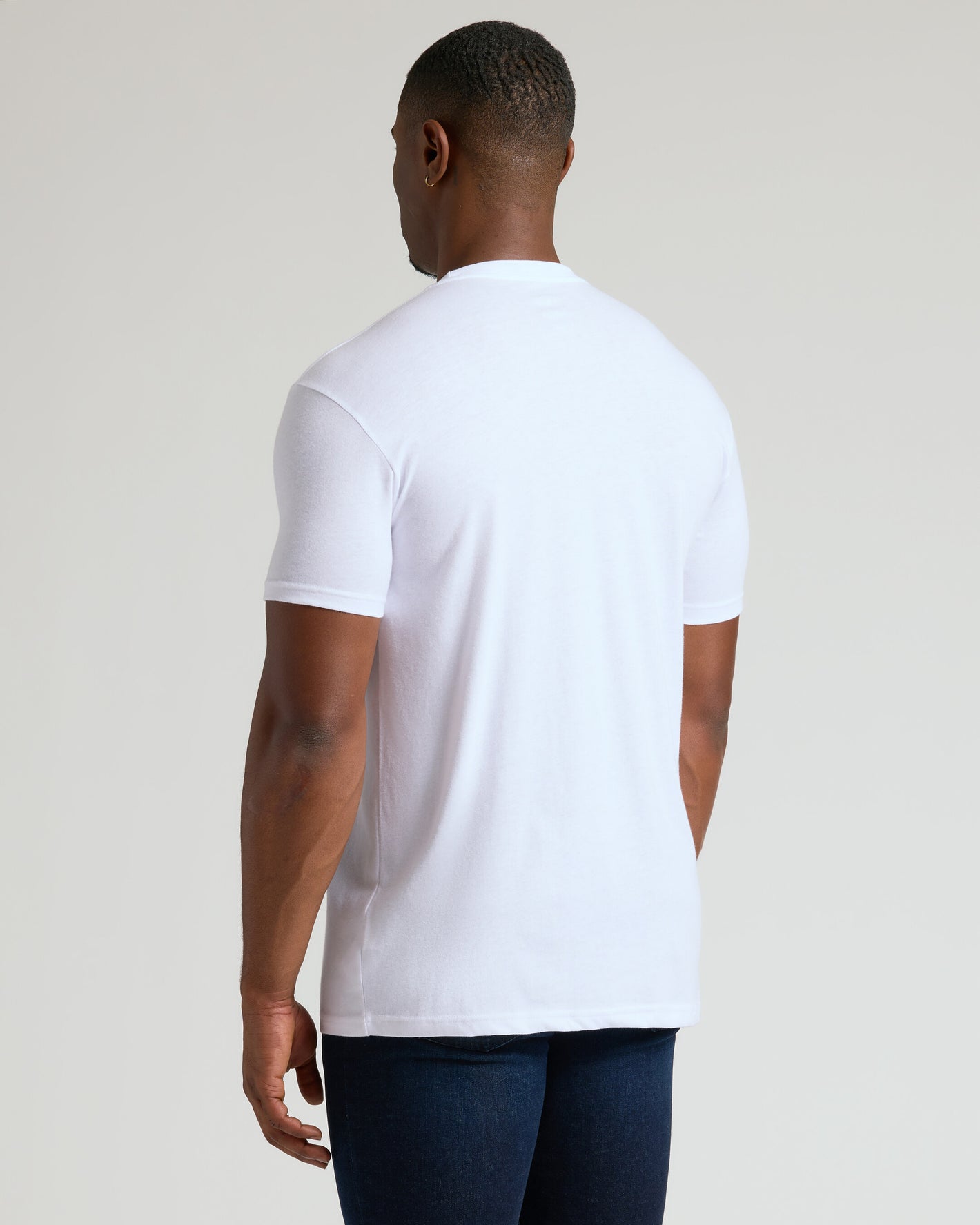 All White Tall Classic Crew 10-Pack worn with dark blue jeans.