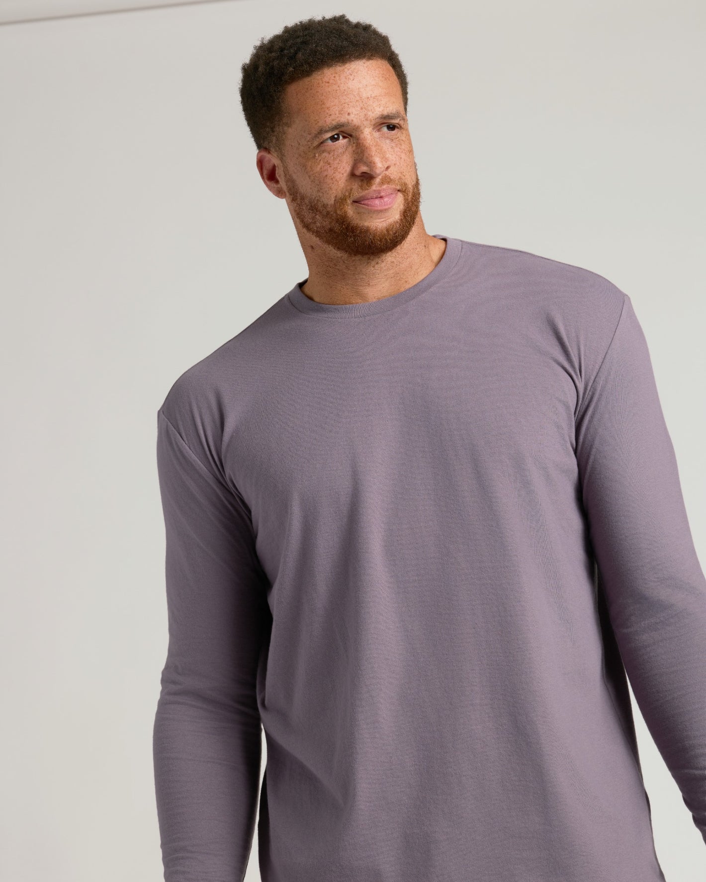 Man wearing Ashberry Tall Long Sleeve T Shirt, gazing left.