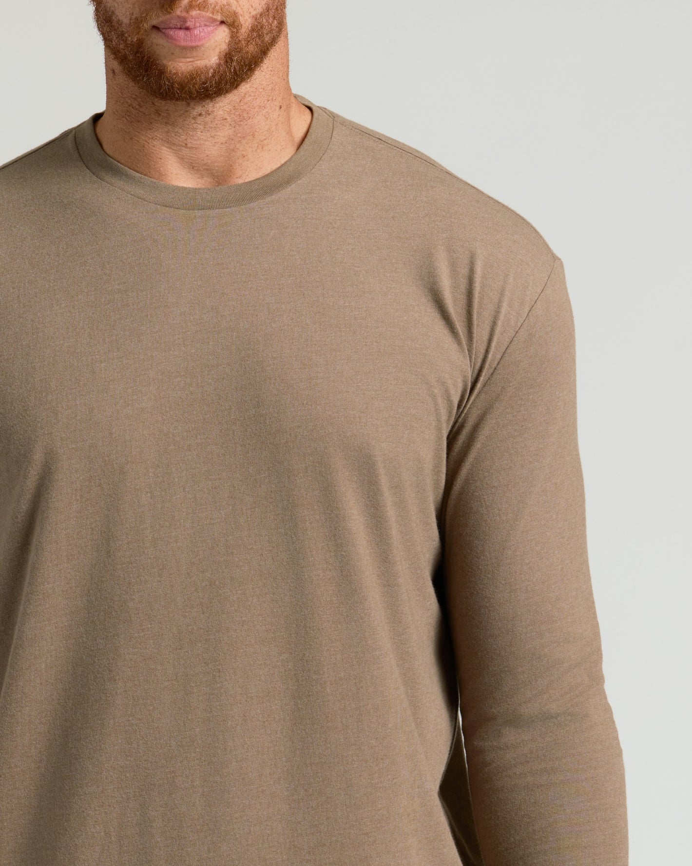 Person in khaki-tone Seasonal Tall Classic Long Sleeve Crew 3-Pack shirt.