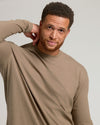 Man wearing Dark Heather Sagewood Tall Long Sleeve T-Shirt, relaxed expression.
