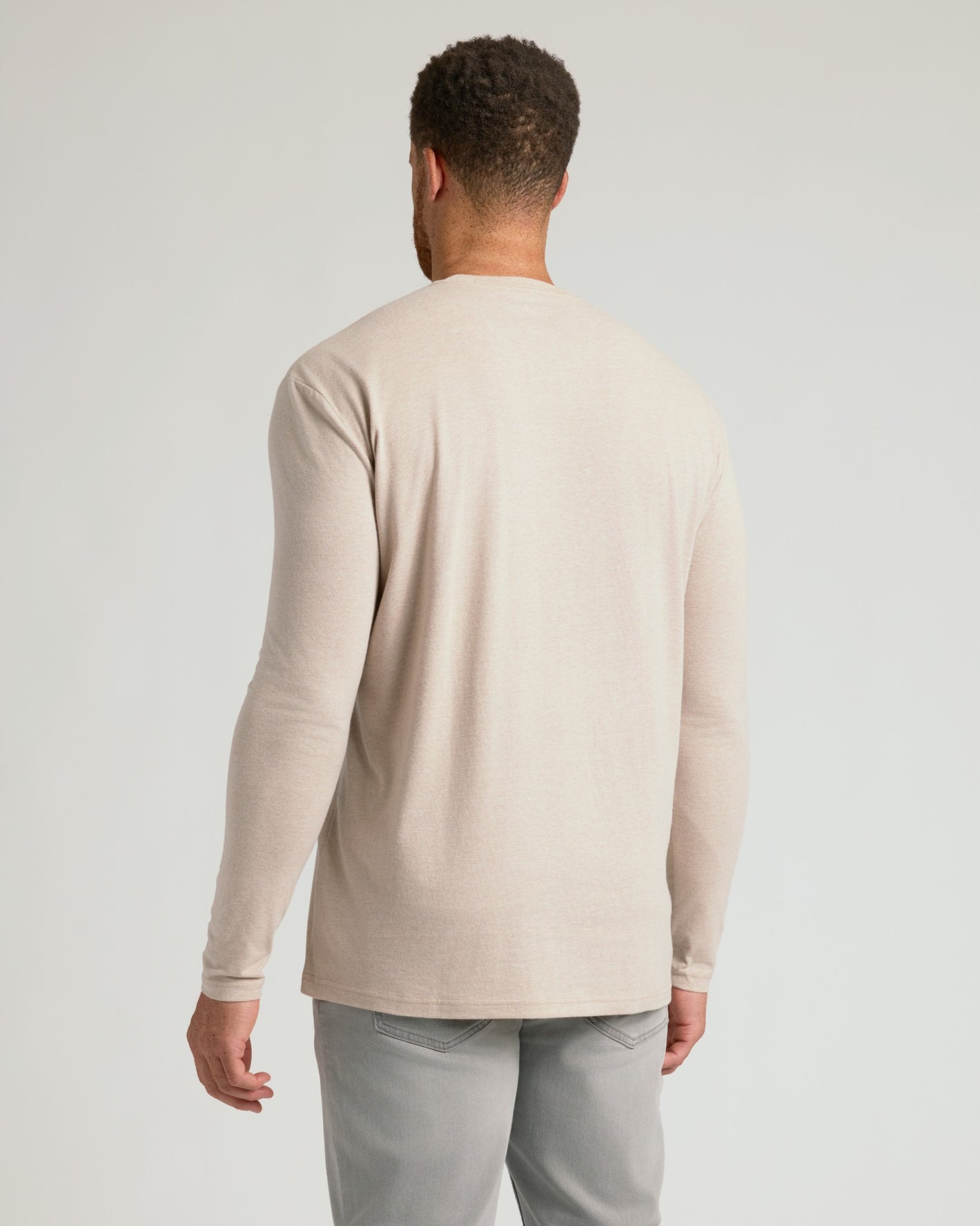 Heather Truffle Tall Long Sleeve T Shirt, back view, worn with gray pants.