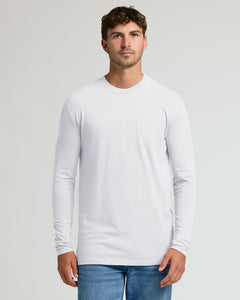 True ClassicA man wearing a plain white long-sleeve crewneck t-shirt and blue jeans, standing against a light gray studio background.