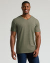 Model wearing Heather Military Green Tall Short Sleeve Classic V-Neck with dark jeans.