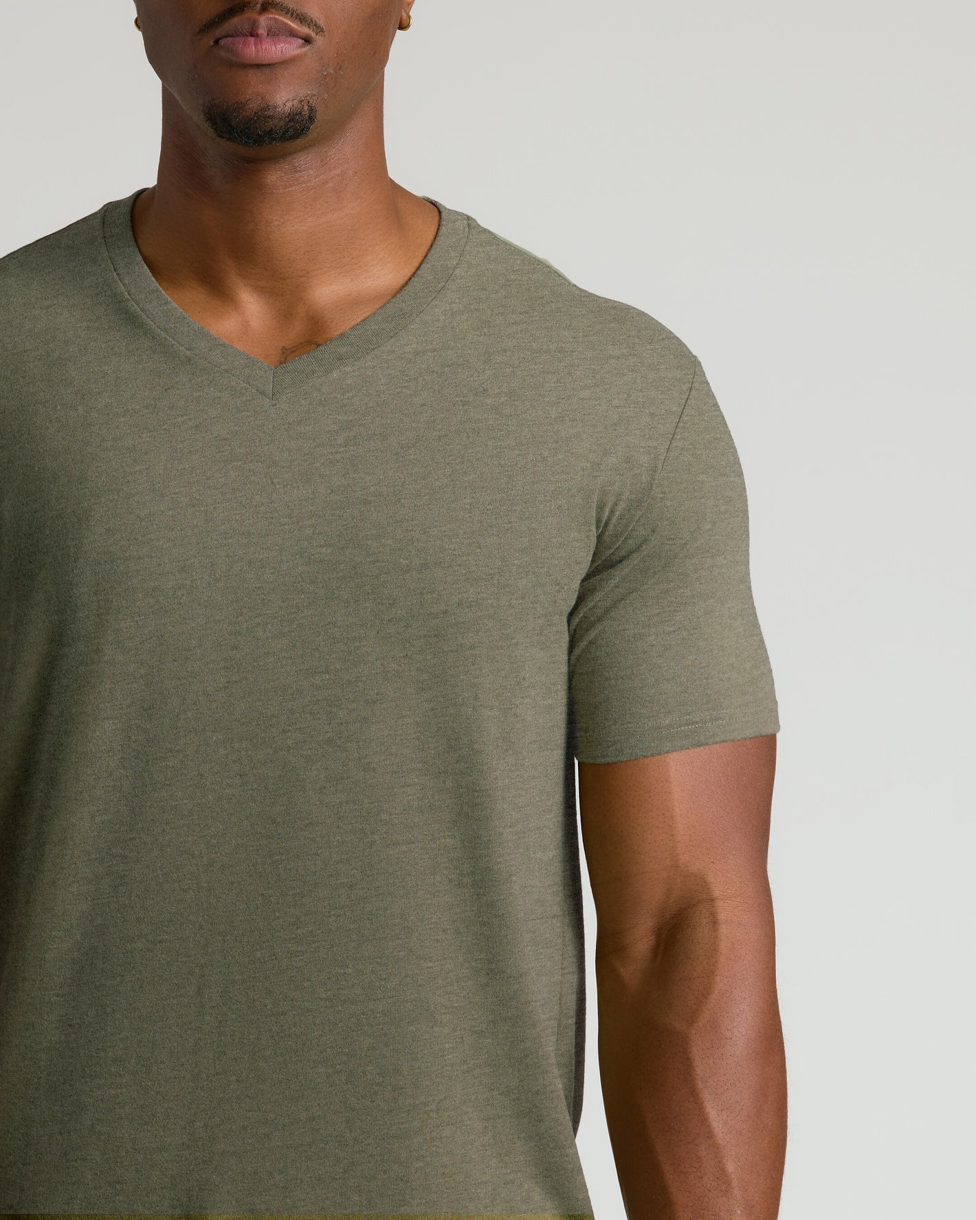 Man wearing Heather Military Green Tall Short Sleeve Classic V-Neck shirt.