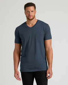 True ClassicMan wearing a dark blue t-shirt against a gray background