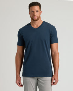 True ClassicModel in Navy Tall Short Sleeve V-Neck, light gray trousers.