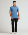 Young man models Dark Heather Blue Lake Short Sleeve Tall Polo.