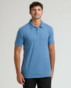 Young man in Dark Heather Blue Lake Short Sleeve Tall Polo.