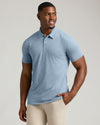 Heather Indigo Short Sleeve Tall Polo on fit man smiling, hands in pocket.
