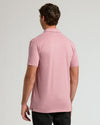 Back view of Light Heather Boysenberry Short Sleeve Tall Polo on male model.