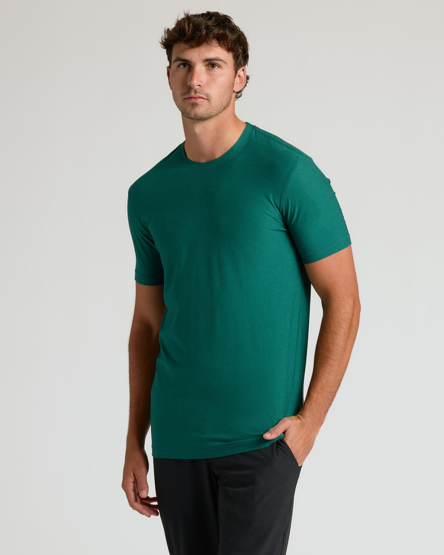 Clover Tall Active Crew Neck 2.0 on model, hand in pocket.