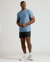 Heather Azul Tall Active Crew Neck 2.0 modeled with athletic shorts and sneakers.