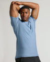 Heather Azul Tall Active Crew Neck 2.0 worn by fit man stretching.