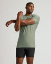 Heather Juniper Tall Active Crew Neck 2.0: athletic man stretching in fitted tee.