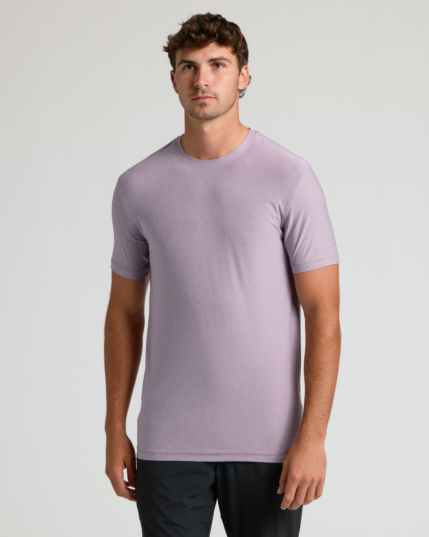 Man wearing Iris Tall Active Crew Neck 2.0, neutral background.