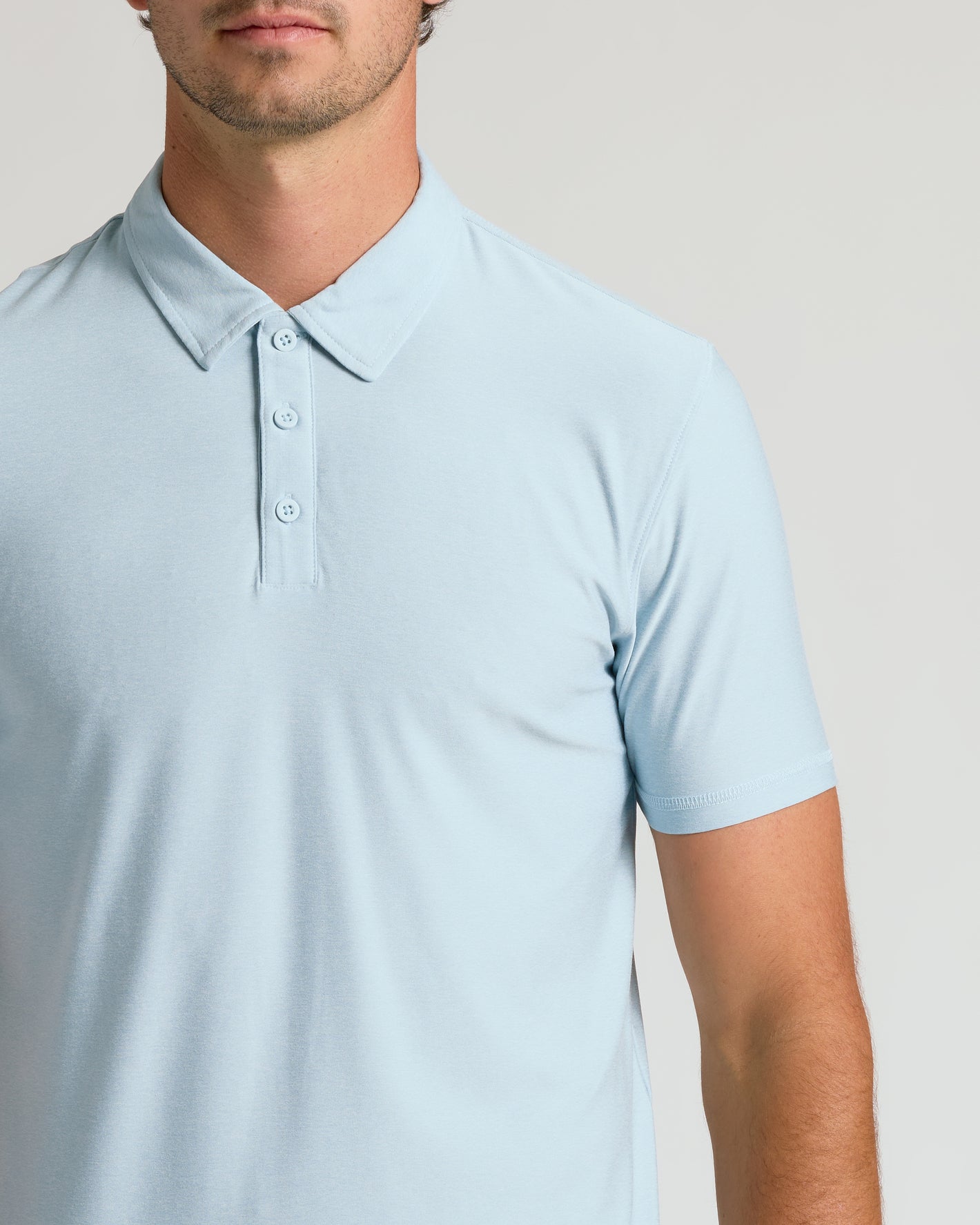 Man wearing Arctic Short Sleeve Tall Active Polo with classic collar and placket.