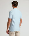 Back view of Arctic Short Sleeve Tall Active Polo on a man.