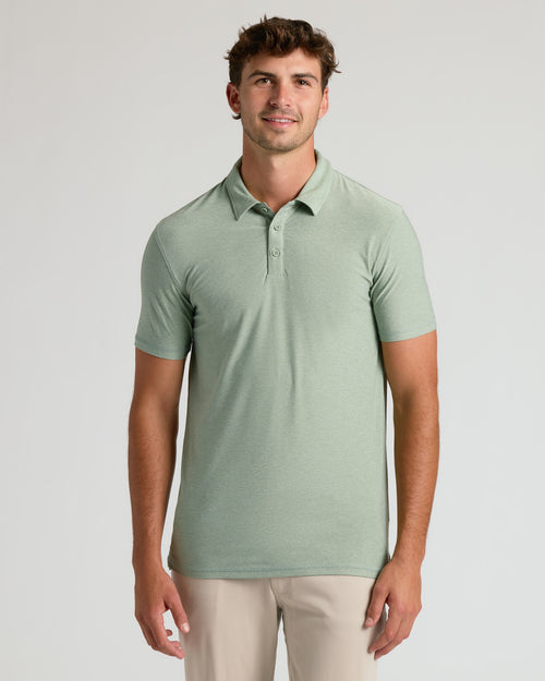 Young man wearing Lichen Short Sleeve Tall Active Polo.