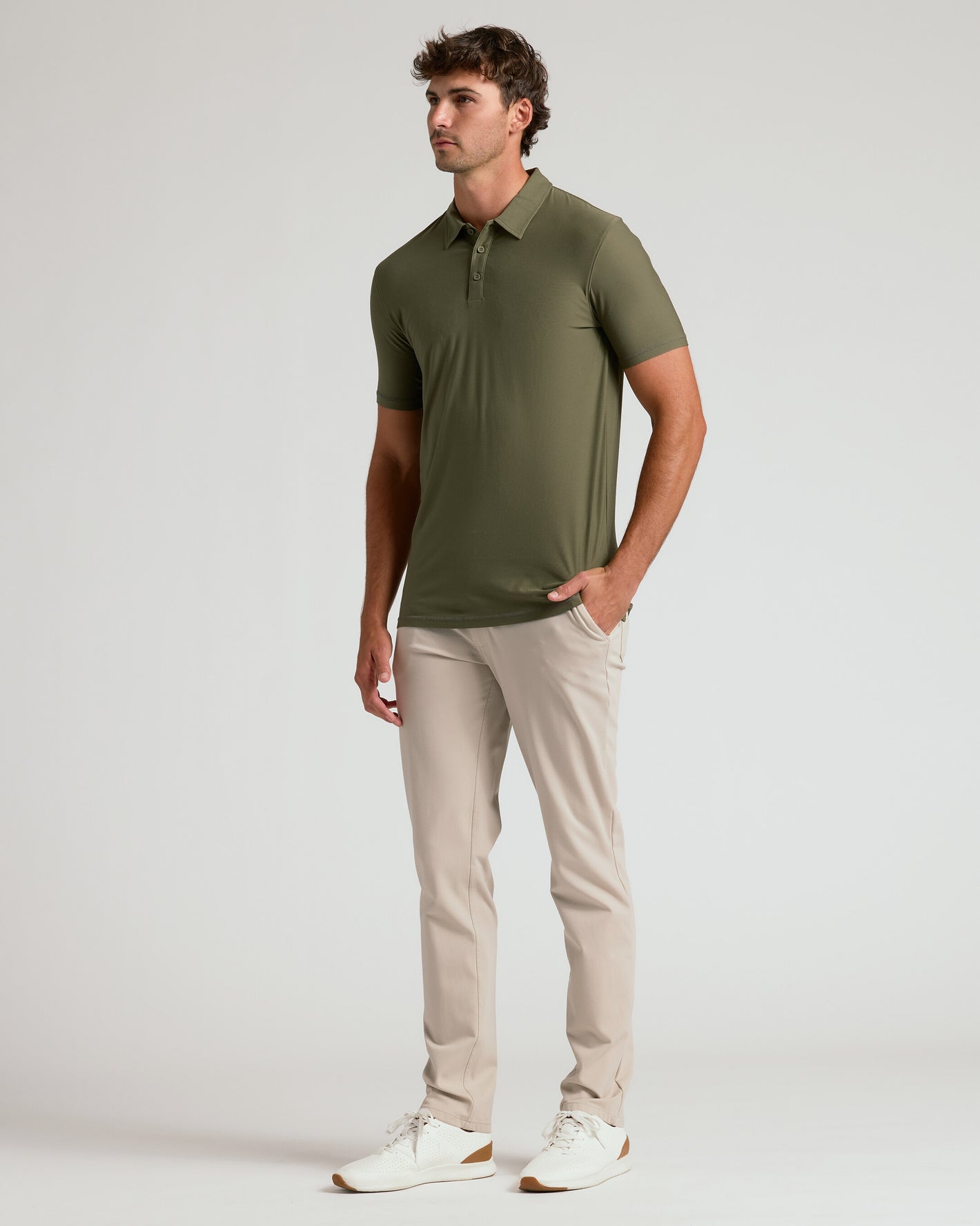 Military Green Short Sleeve Tall Active Polo on male model, beige trousers.