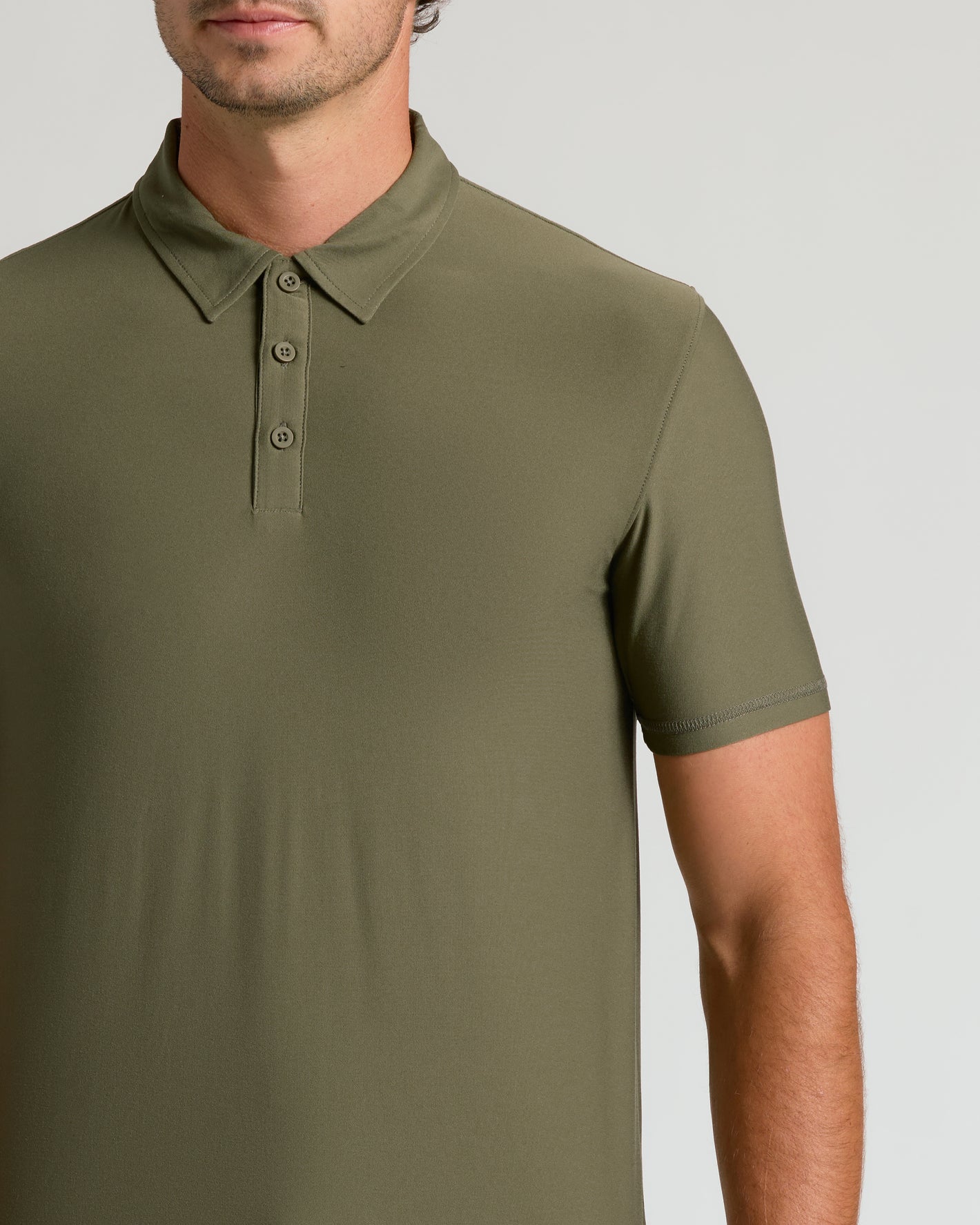 Military Green Short Sleeve Tall Active Polo on male model's torso.