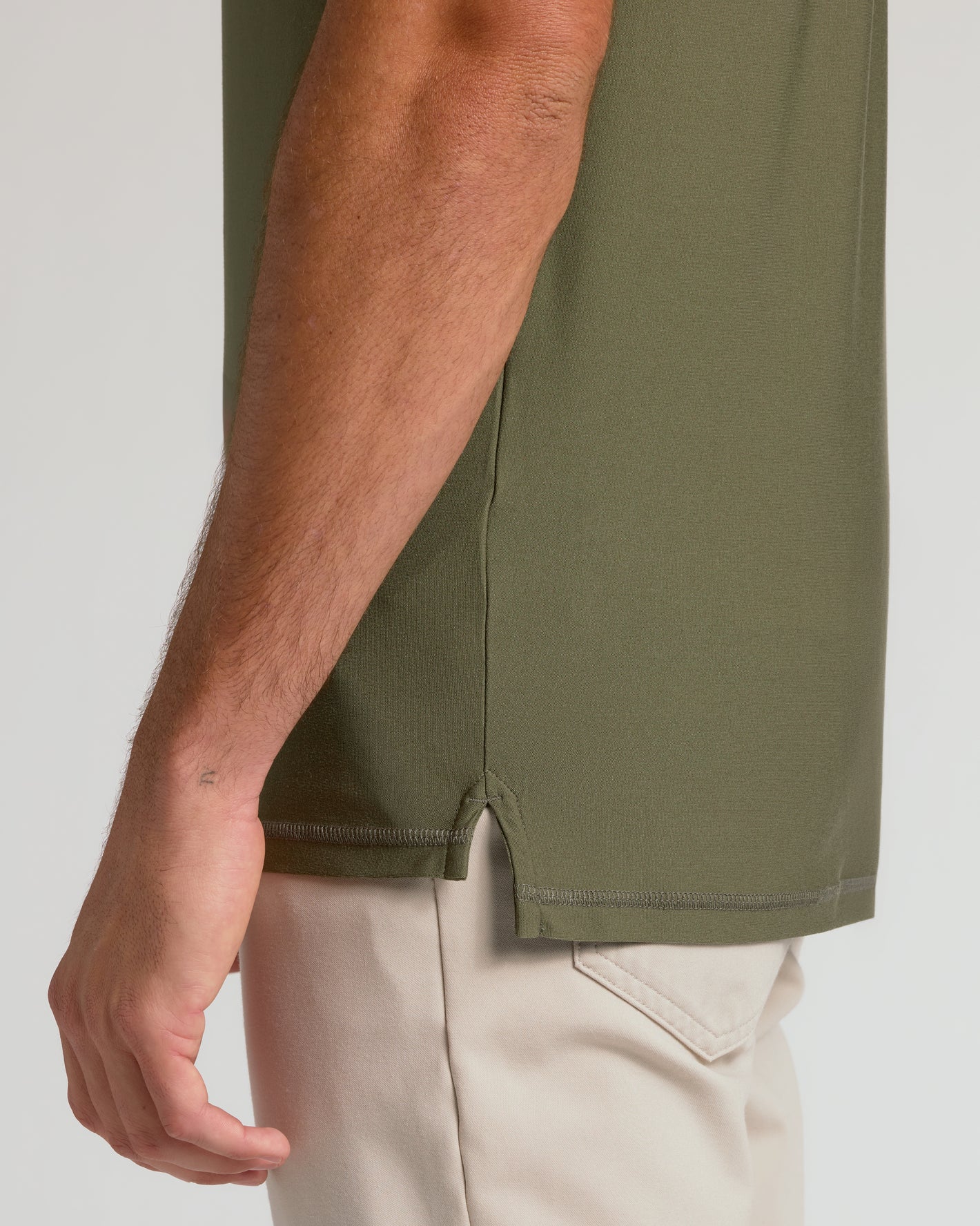 Military Green Short Sleeve Tall Active Polo with side slit and stitching detail.