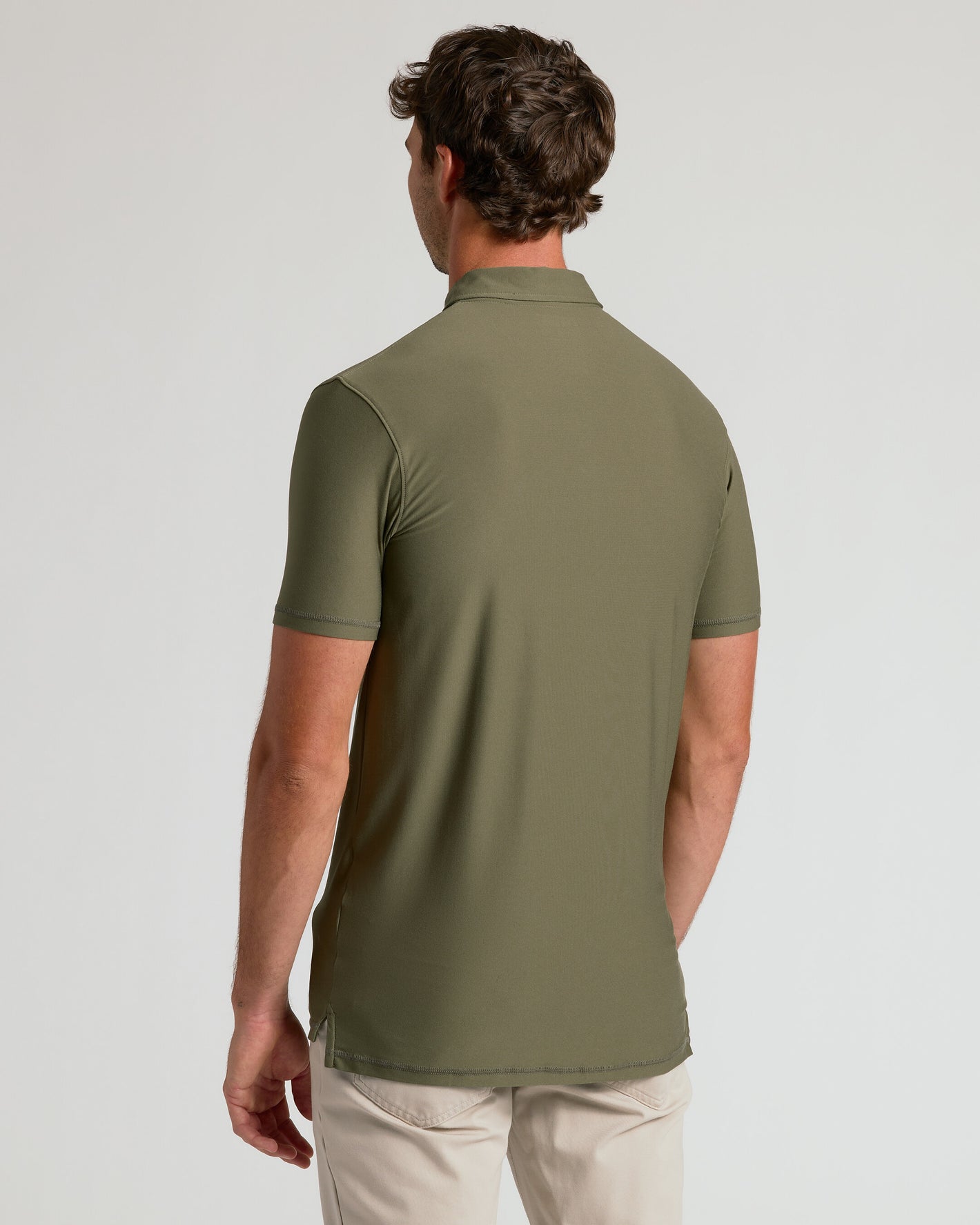 Back view of man in Military Green Short Sleeve Tall Active Polo.