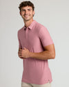 Young man wearing Quartz Rose Short Sleeve Tall Active Polo.