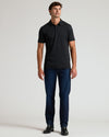 Model wearing Black Tall Premium Pima Polo with dark jeans and boots.