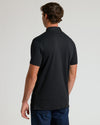 Black Tall Premium Pima Polo, back view, worn with dark blue jeans.