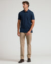 Navy Tall Pima Polo on male model with khaki chinos.
