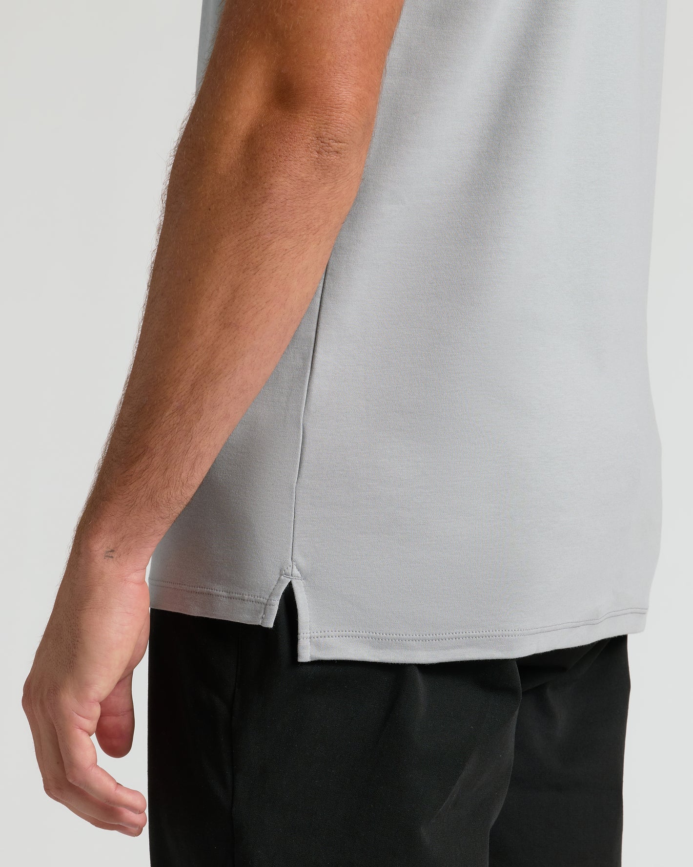 Steel Tall Premium Pima Polo, side-profile, featuring a small side slit.