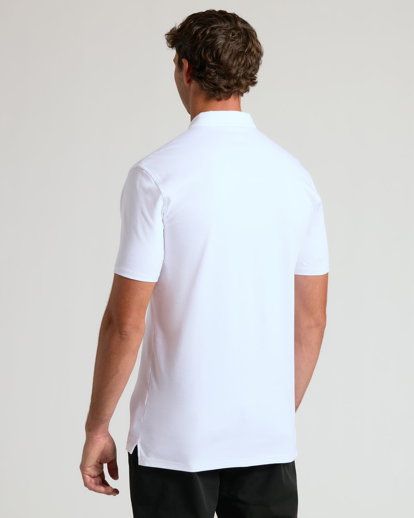 Back view of man in White Tall Premium Pima Polo.