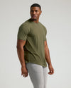 Young man in Military Green Short Sleeve Tall Curved Hem Crew.