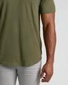 Military Green Short Sleeve Tall Curved Hem Crew on model's midsection.
