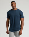 Young man wearing Navy Short Sleeve Tall Curved Hem Crew.