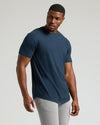Model wearing Navy Short Sleeve Tall Curved Hem Crew with light gray pants.