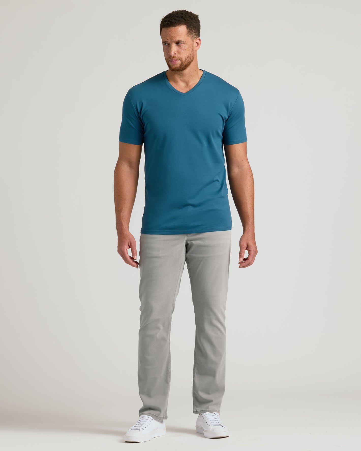 Lagoon Tall Premium Pima V-Neck on male model with jeans and sneakers.