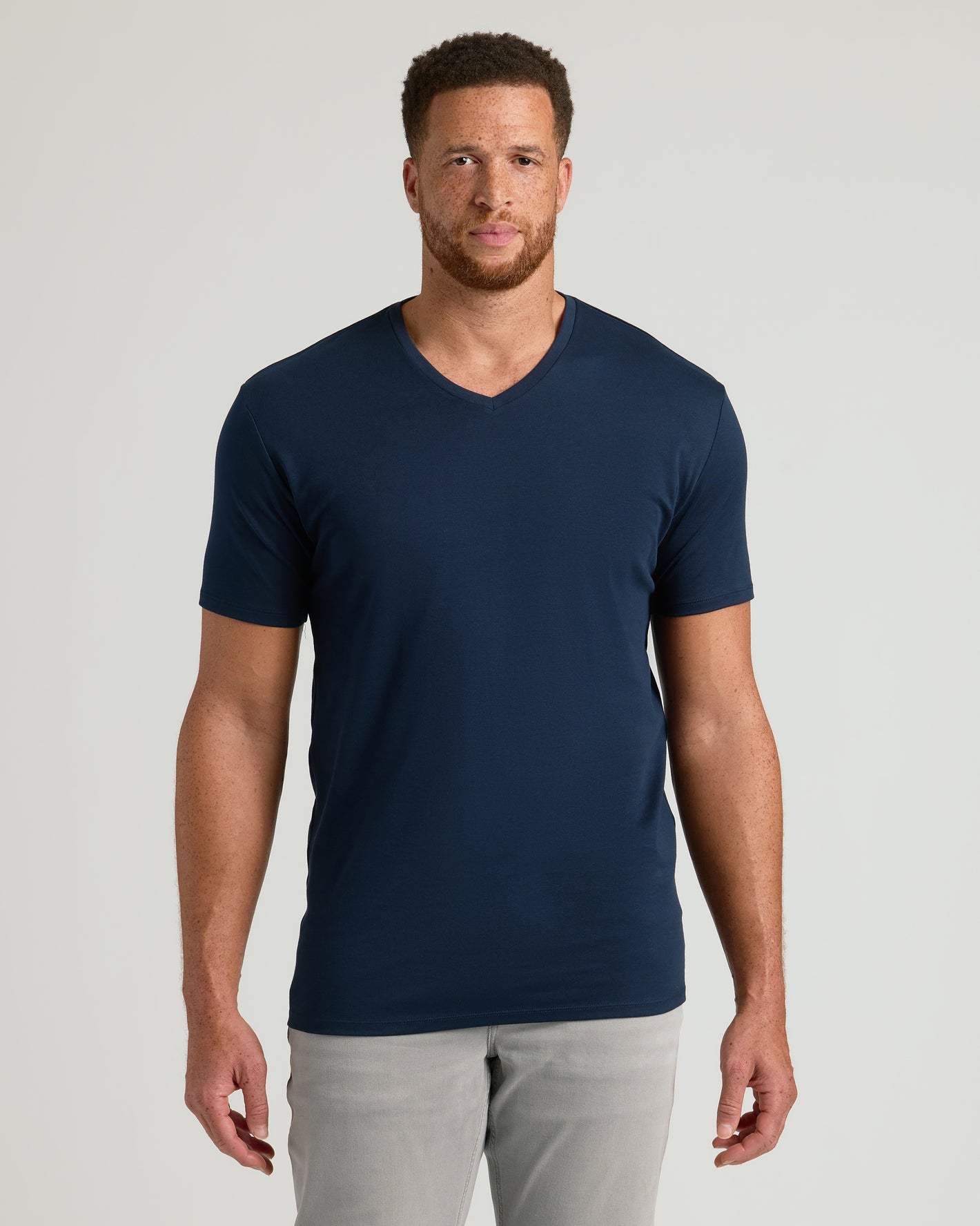 Tall model in Navy Premium Pima V-Neck, showcasing tailored fit.