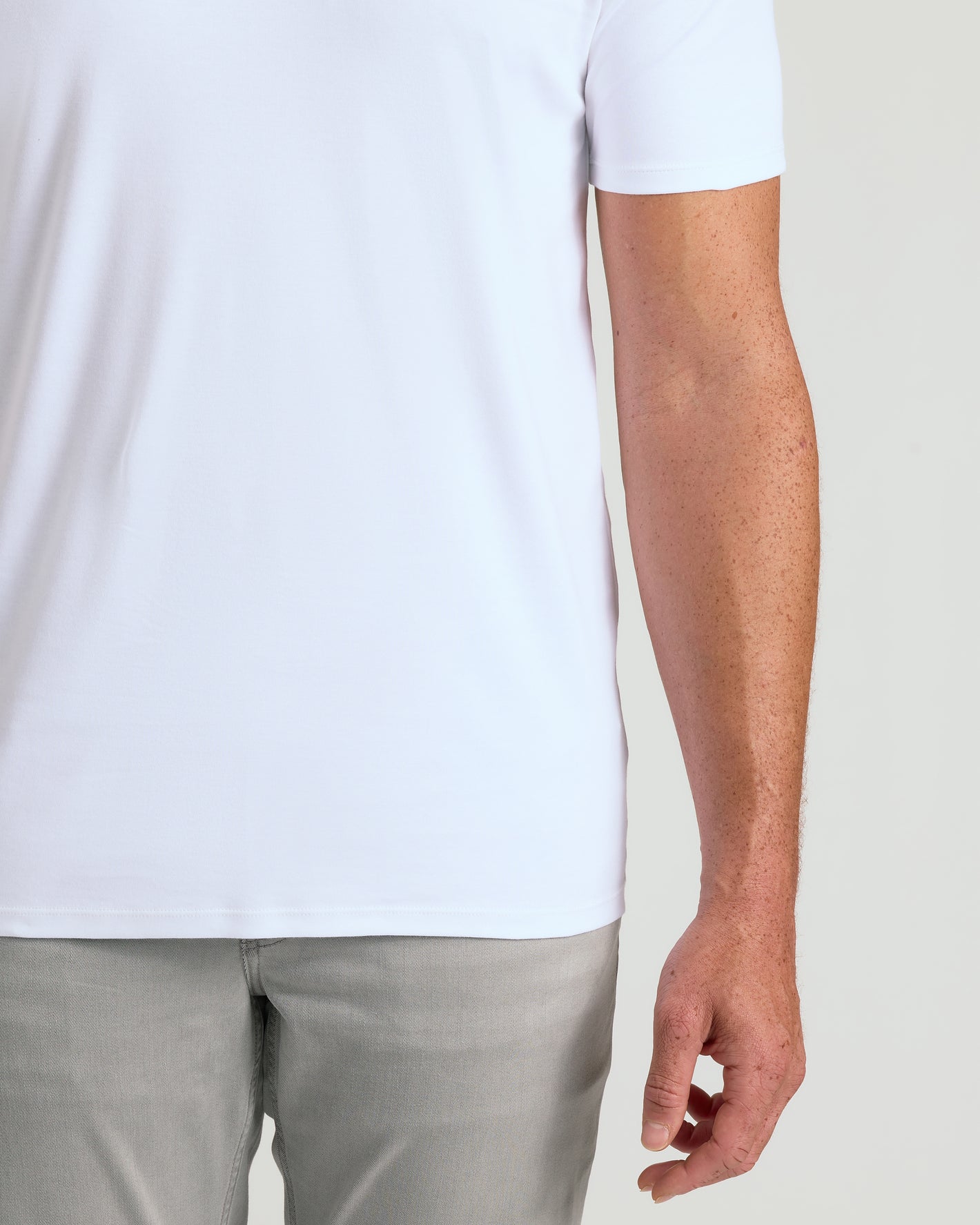White Tall Premium Pima V-Neck on model's midsection, showcasing tailored fit.