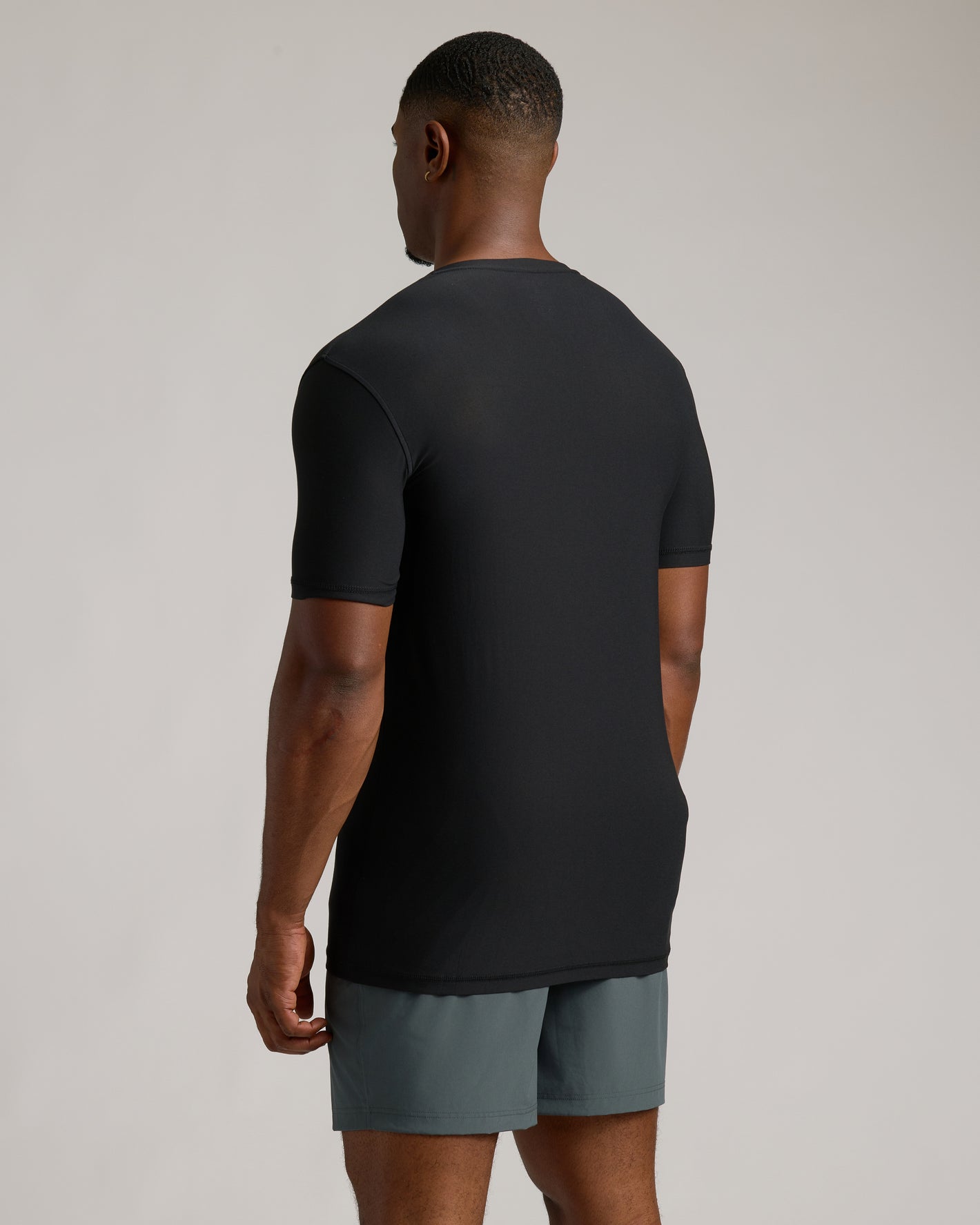 Black Tall Active V-Neck 3-Pack on model, showcasing fit and length.